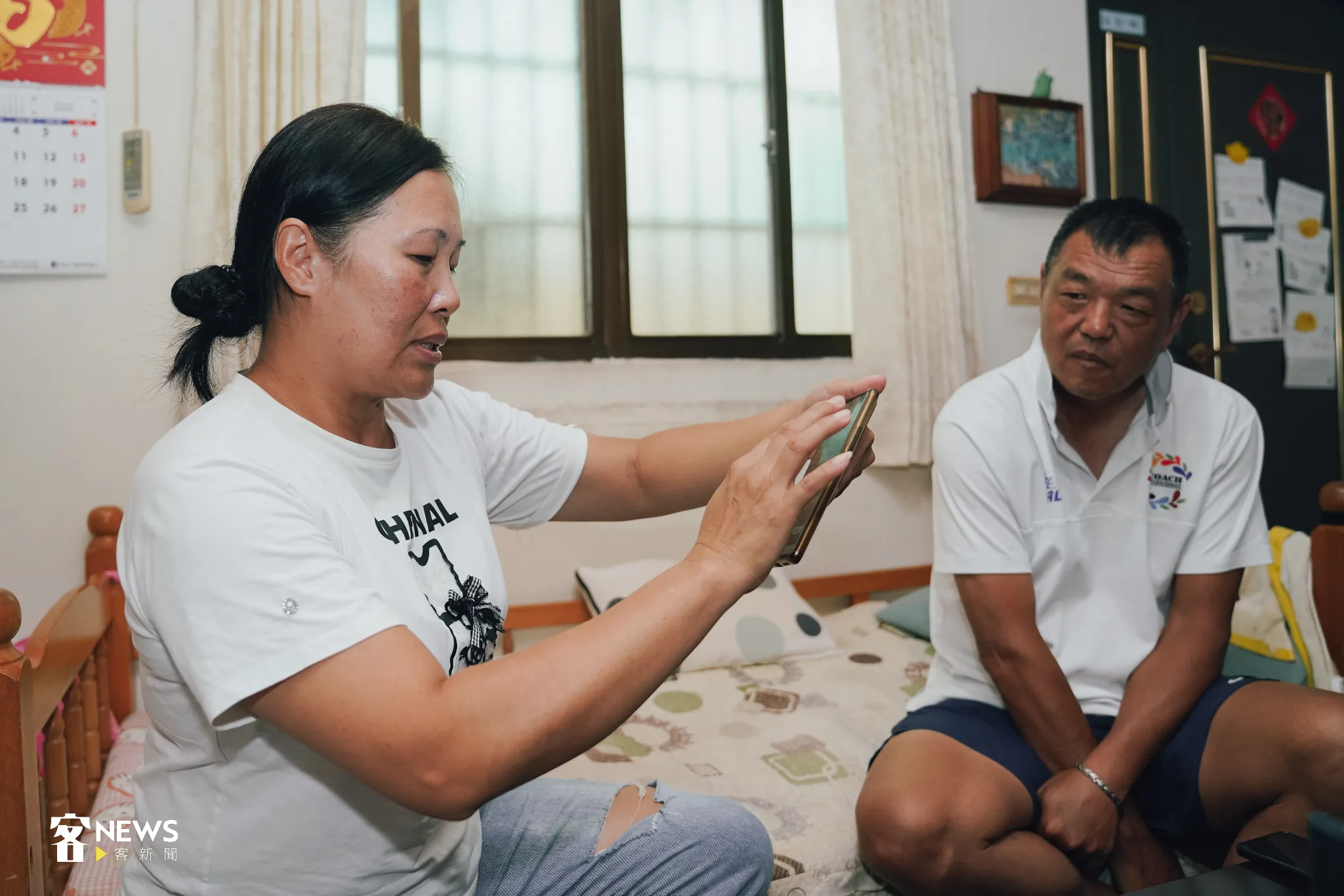 張奇玉與彭煥樹細說彭名揚在田徑場上的故事。宋佩遙攝